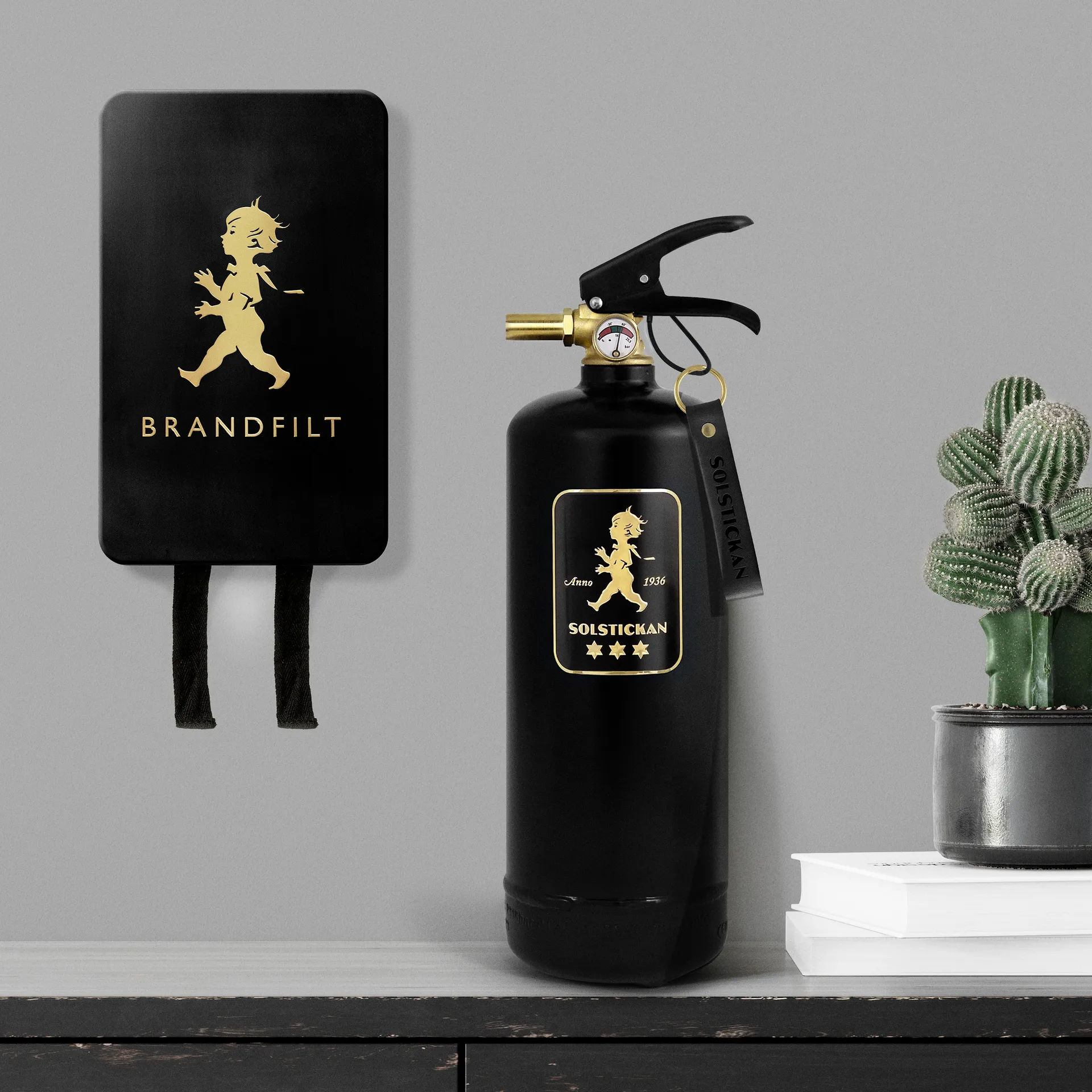 Solstickan brannslukker 2 kg, Svart-gull Solstickan Design